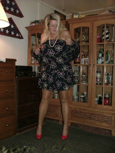 Fat grandmother with blonde hair exposes herself in tan nylons and garters