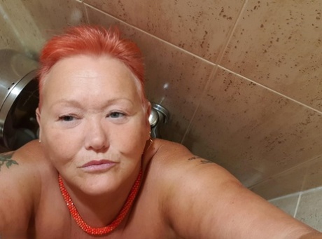 Fat granny with red hair Valgasmic Exposed takes naked selfies at home