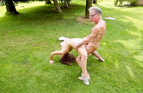 Petite teen girl has sex on the back lawn with two old men at once