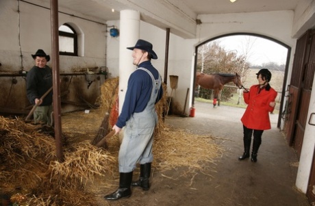 Mature amateur Adela rides the grooms' stiff boners & gets a DP in the stables